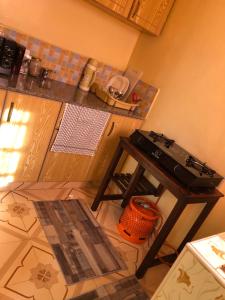 a kitchen with a stove and a counter top at Mt zion penthouse in Lake View Estate
