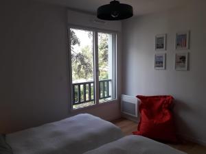 Ένα ή περισσότερα κρεβάτια σε δωμάτιο στο Les Pins 208