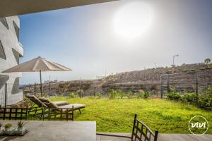 Κήπος έξω από το ViVi Homes - Higueron Premium Wellness, Sauna, Pool & Hot tub