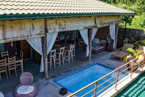 Imagem da galeria de La Pointe Beach Huts em Praslin