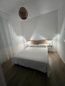 Ένα ή περισσότερα κρεβάτια σε δωμάτιο στο Casa Persefone