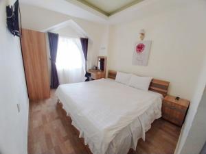 Postel nebo postele na pokoji v ubytování Vanilla Dalat Hotel