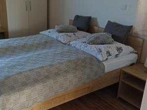 two beds sitting next to each other in a room at DREVENÝ APARTMÁN Slovenský raj Hrabušice in Hrabušice