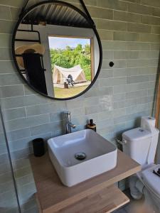 a bathroom with a sink and a mirror at Au coeur des plantations in La Possession +36 photos