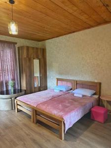 Postel nebo postele na pokoji v ubytování guest house zizi
