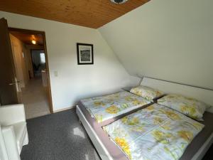 Postel nebo postele na pokoji v ubytování Mansarde Hesselbach