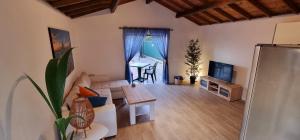 a living room with a couch and a table at Casa Joy in Tejina de Isora