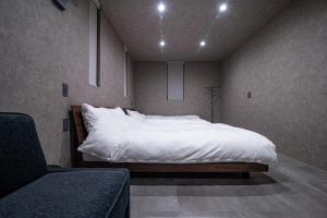 Postel nebo postele na pokoji v ubytování yado taniguchi