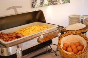 a kitchen counter with a tray of food and eggs at Hotel Villa Adriana in Monterosso al Mare