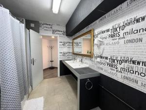 a bathroom with a sink and a mirror at Hello Feria in Madrid +65 photos
