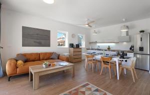 a living room with a couch and a table at Lovely Home In Pasman in Pašman