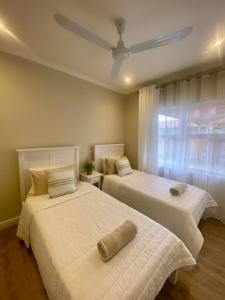 Ένα ή περισσότερα κρεβάτια σε δωμάτιο στο Mossel Bay Self Catering - Near Bayview Centre & Hospital