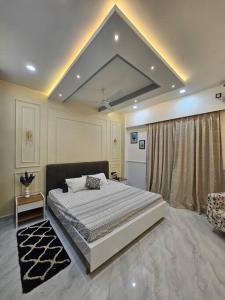 Кровать или кровати в номере Zanskar in Jorhat