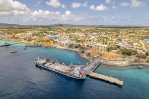 a large ship docked at a dock in the water at Hausmann Penthouse with Stunning Sea View in Kralendijk +43 photos