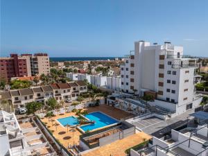 an aerial view of an apartment complex with a swimming pool at Luxury Apartment in Mil Palmeras in Dehesa de Campoamor