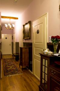 a room with a hallway with a door and a table at Hotel Victoria in Schlangenbad