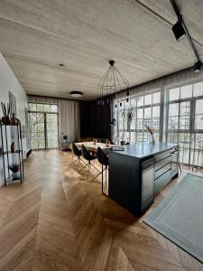 a large room with a kitchen and a dining room at Exclusive apartment in Heart of Town in Vanalinn