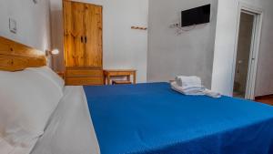 Postel nebo postele na pokoji v ubytování La Tortuga Lodging Rooms