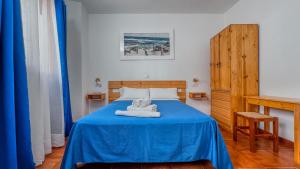 Postel nebo postele na pokoji v ubytování La Tortuga Lodging Rooms