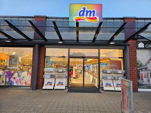 a store front of a store with glass doors at Pension Laatzen - by Dzafer & Sohn wo Erholung sich Lohnt in Hannover