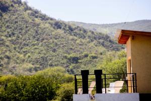 a balcony of a house with a view of a mountain at Cabañas Miraluna in Villa General Belgrano