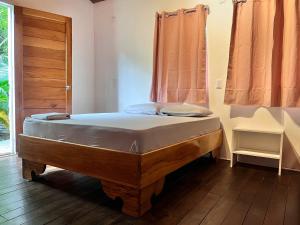 Кровать или кровати в номере La Tribu Boutique Hostel for women