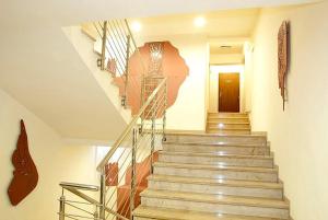 a staircase in a building with a stair case at Hotel Alexander in Krakow