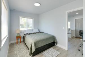 a bedroom with a bed and a window at End Unit with Clear Lake Access in NorCal! in Clearlake