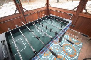 an overhead view of a pool table in a room at Black bear cabin with blow up hot tub in Necedah