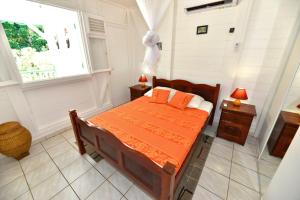Sur la route des épices - Location villas avec piscine et jacuzzi客房内的一张或多张床位