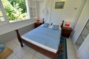 Sur la route des épices - Location villas avec piscine et jacuzzi客房内的一张或多张床位