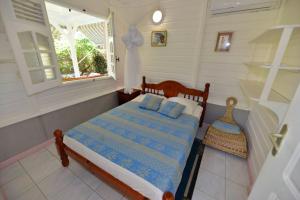 Sur la route des épices - Location villas avec piscine et jacuzzi客房内的一张或多张床位
