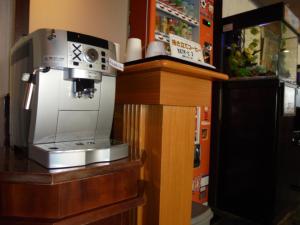 a coffee machine sitting on top of a counter at Terminal Art Inn - Vacation STAY 66156v in Niigata