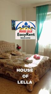 Ένα ή περισσότερα κρεβάτια σε δωμάτιο στο "HOUSE OF LELLA" Appartamento 2 Camere da letto