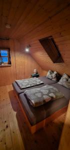 Ένα ή περισσότερα κρεβάτια σε δωμάτιο στο Ferienhaus-wurzbach