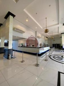 a lobby with a check in counter in a building at Piazza com acesso ao Acqua Park - Temporada CN Adriele in Caldas Novas