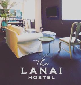 a room with a couch and a chair and a table at Second floor - Vacation STAY 82648v in Naha