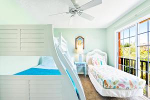 a white bedroom with a bunk bed and a window at Siesta Key Village, Heated Pool, Beach Access 4 min Walk, 3bdr in Siesta Key +38 photos