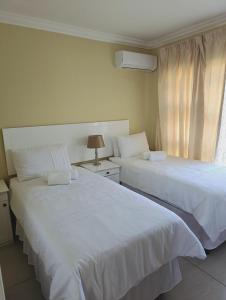 Ένα ή περισσότερα κρεβάτια σε δωμάτιο στο SammyGrace Holiday Home