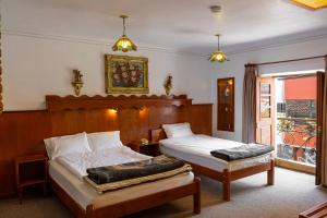 Postel nebo postele na pokoji v ubytování Hotel La Posada de Atahualpa