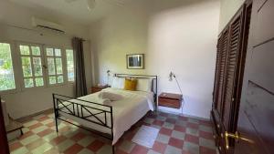 Ένα ή περισσότερα κρεβάτια σε δωμάτιο στο Villa Mila