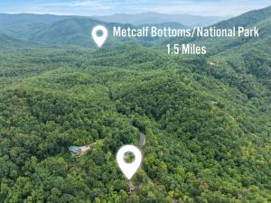 an aerial view of a forest with two white spots at Restoration Retreat at Greenbrier cabin in Sevierville