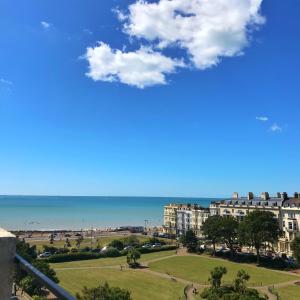 a view of a beach and buildings and the ocean at Penthouse Seaview Warrior Square in Hollington +14 photos