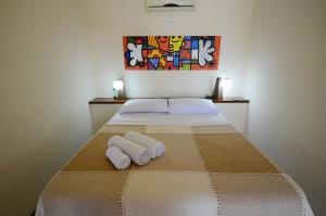 Cama o camas de una habitación en Flat Vila 4 Amigos