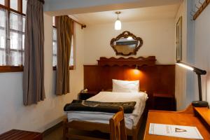 Postel nebo postele na pokoji v ubytování Hotel La Posada de Atahualpa