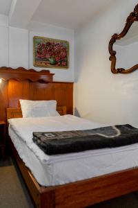 Postel nebo postele na pokoji v ubytování Hotel La Posada de Atahualpa