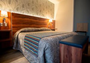 Postel nebo postele na pokoji v ubytování Hotel Parque Satelite + 37 fotografií