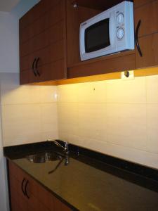 Nhà bếp/bếp nhỏ tại Olimpo Hotel & Suites