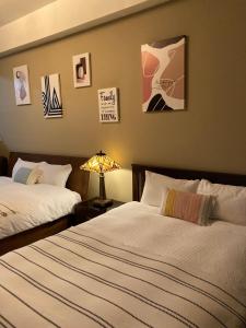Postel nebo postele na pokoji v ubytování Grace Homestay