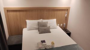 Postel nebo postele na pokoji v ubytování Apto 203 Legacy Suítes + 36 fotografií